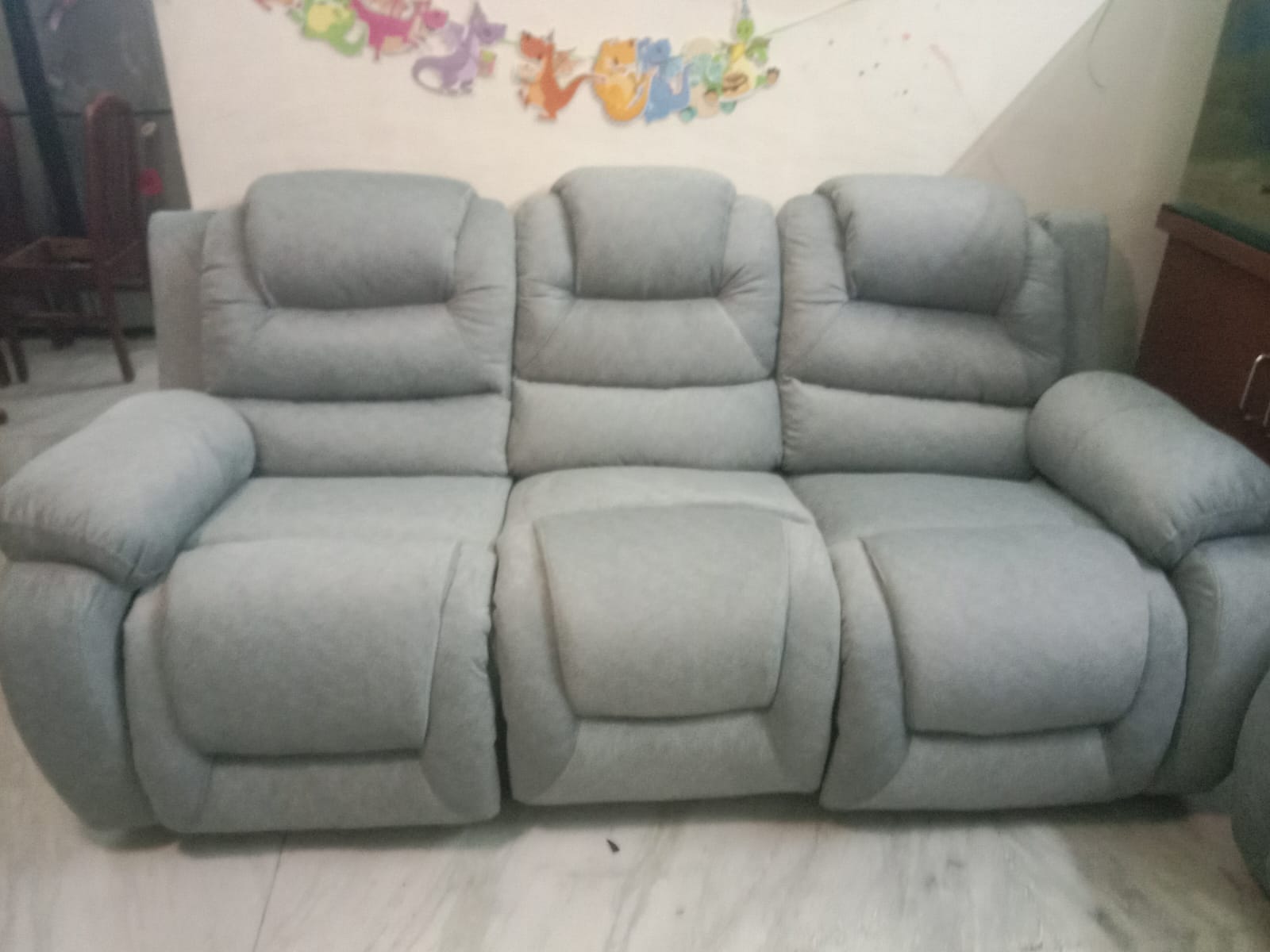 Grey three-seat recliner sofa