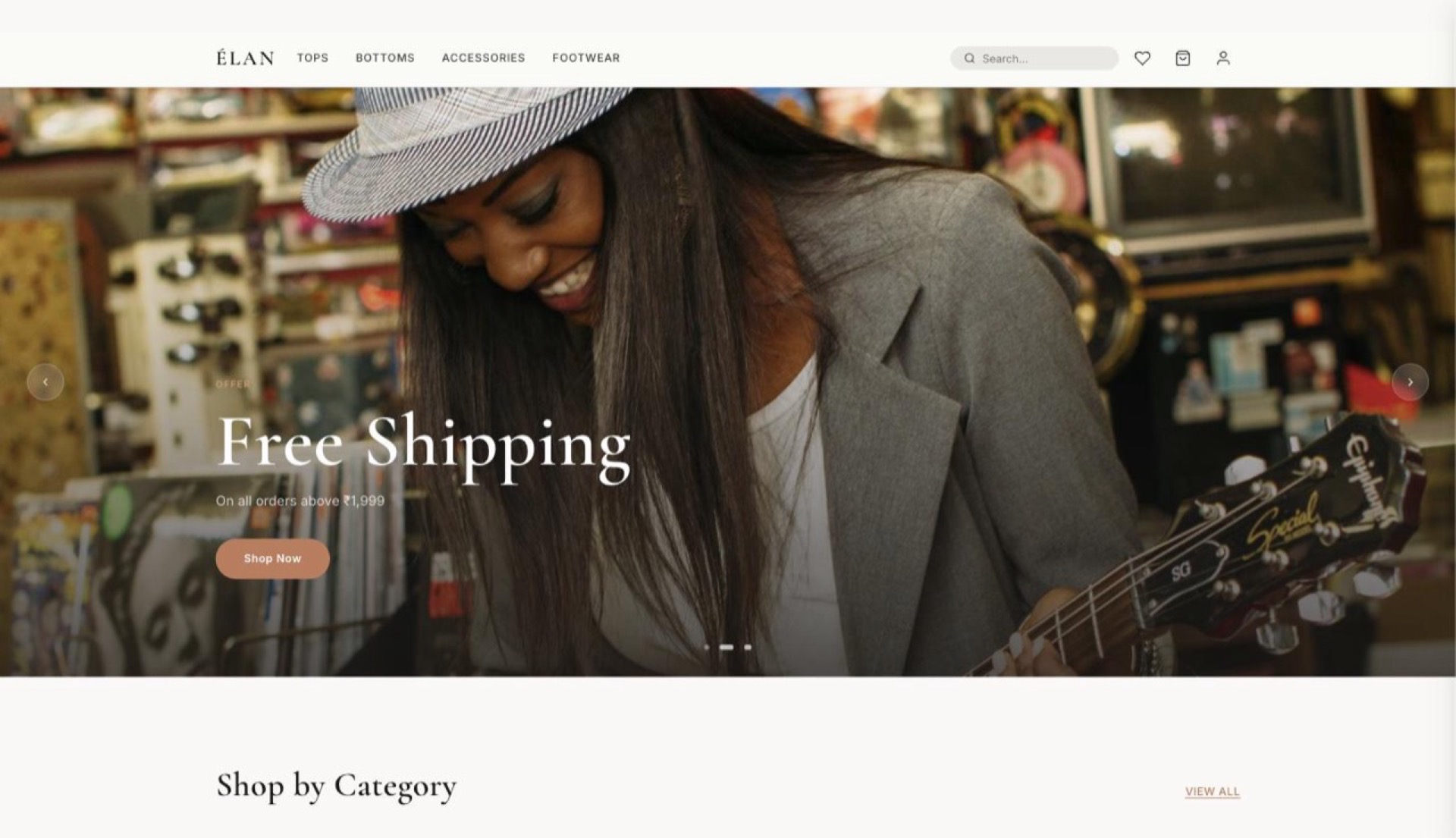 ÉLAN ecommerce demo homepage with a full-bleed hero image and shop-by-category grid